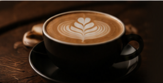 Latte art in a dark ceramic cup